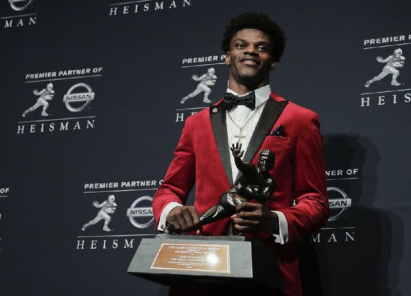 Louisville’s Lamar Jackson on Saturday became the 14th quarterback in the past 17 years to win the Heisman
Trophy in New York City.
