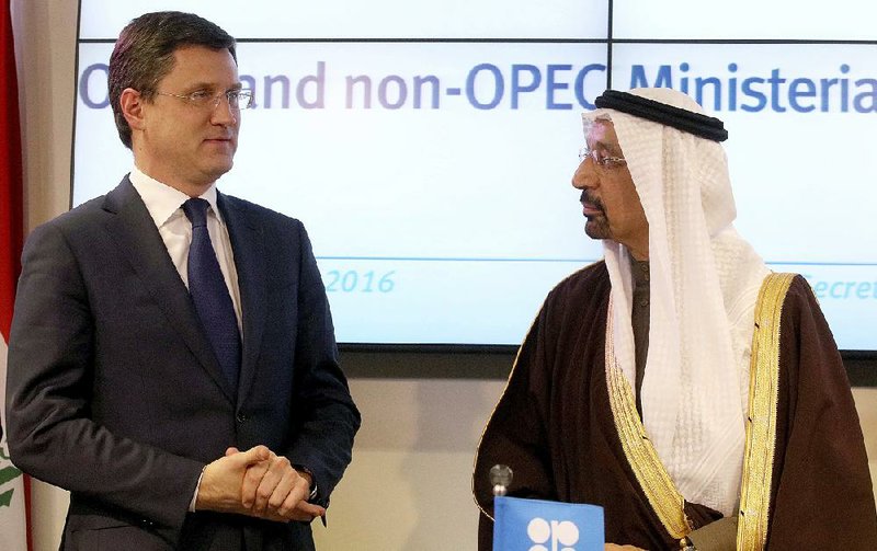 Alexander Novak (left), Russia’s energy minister, and Saudi Arabian counterpart Khalid al-Falih speak at a news conference Saturday after an OPEC meeting in Vienna.

