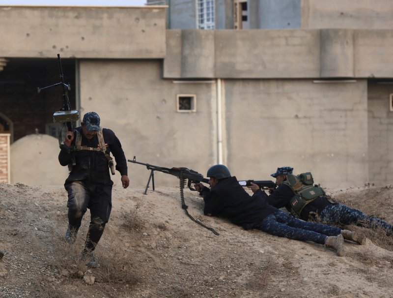 Iraqi federal police forces fight Islamic State militants on the front line, outside Mosul, Iraq, Saturday, Dec. 10, 2016.  