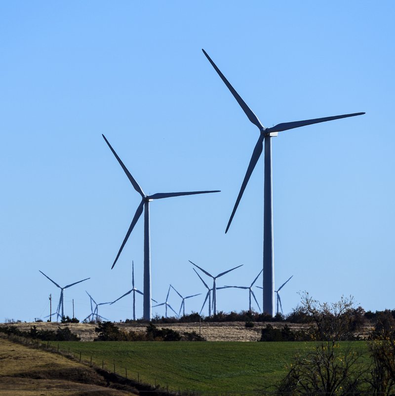 This photo provided by Google shows windmills at a wind farm in Minco, Okla., that provides Google with some of its renewable energy. Google says it believes that beginning in 2017, it will have amassed enough renewable energy to meet all of its electricity needs throughout the world. 