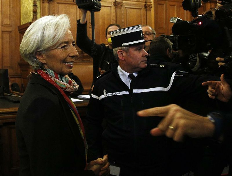 International Monetary Fund chief Christine Lagarde arrives at a special Paris court Monday.
