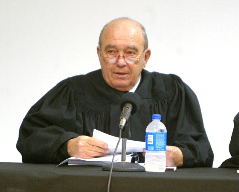 FILE — Arkansas Supreme Court Justice Don Corbin gets ready o hear oral arguments on a case involving the city of Hot Springs' wastewater fees on Thursday, April 30, 2009, at the Roy Rowe Auditorium. (The Sentinel-Record/Richard Rasmussen)
