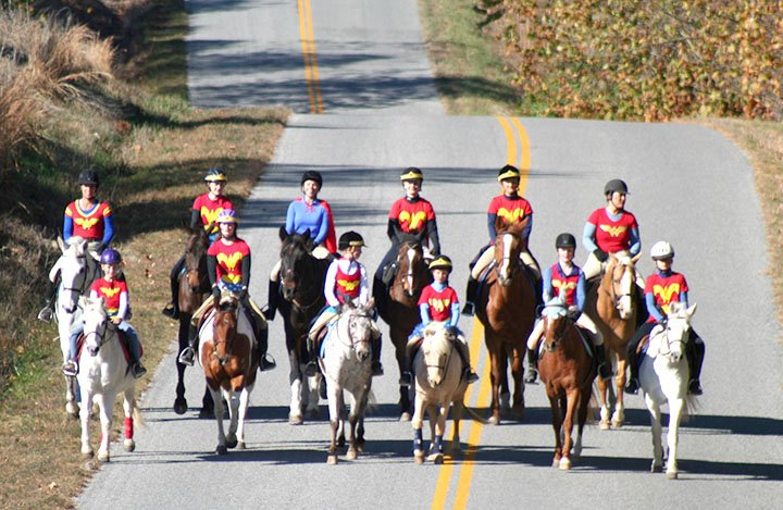 Submitted Photo A group of riders known as the Wonder Women Brigade rode down Arkansas Highway 102 toward the Horses for Healing facility in Highfill Nov. 20 to participate in the first annual Turkey Trot Cross Country Fun Day. The riders included Heather Swope (legends owner, trainer), Molly Wolf, Sumer Brandon, Jordan Cook, Emma Johnson, Rebecca Randall, Bryn Swope-Bell, Chloe Hodge, Alyx Swope-Bell, Rylee Randall, Marguerite Johnson and Lilli Barlow.