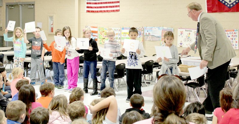 Photo Submitted by Zane Vanderpool Children at Glenn Duffy Elementary School spell and cheer the word &quot;Courtesy&#x201d; at the PAWS Skills Assembly.