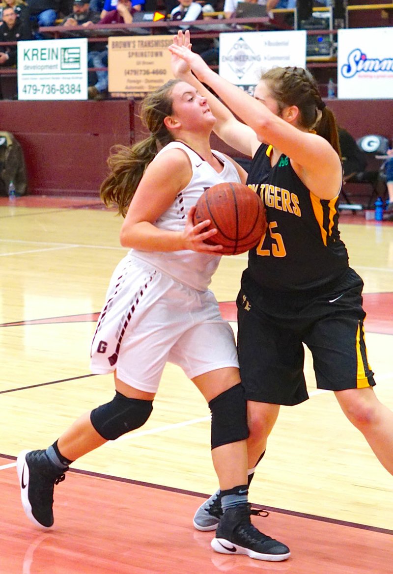 Photo by Randy Moll Gentry&#8217;s Haley Hays attempts a shot against Prairie Grove&#8217;s Parker Sanchez during play at Gentry between Gentry and Prairie Grove High Schools on Friday, Dec. 9.