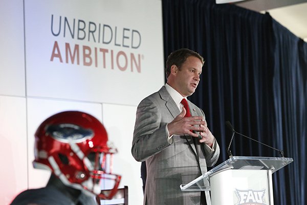 Lane Kiffin gestures as he speaks after being introduced as the new Florida Atlantic head football coach, Tuesday, Dec. 13, 2016, in Boca Raton, Fla. The school announced the move on Twitter on Tuesday, a day after Alabama coach Nick Saban said his offensive coordinator was leaving to take over the Owls. It's the fourth opportunity for Kiffin to be a head coach, after an NFL stint with the Oakland Raiders and college ones at Tennessee and USC. (AP Photo/Wilfredo Lee)

