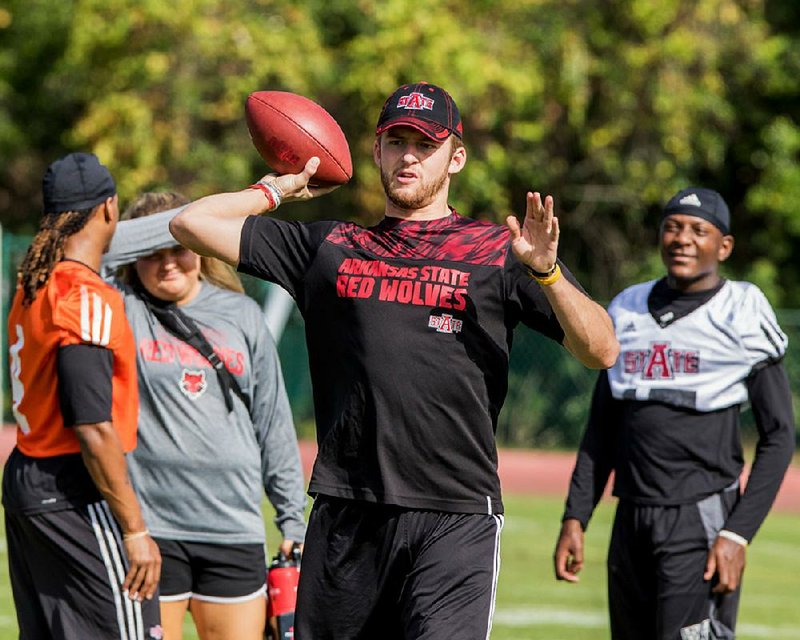 Arkansas State quarterback Justice Hansen, shown during practice Wednesday for the Cure Bowl in Orlando, Fla., has thrown for 2,514 yards and 16 touchdowns this season.