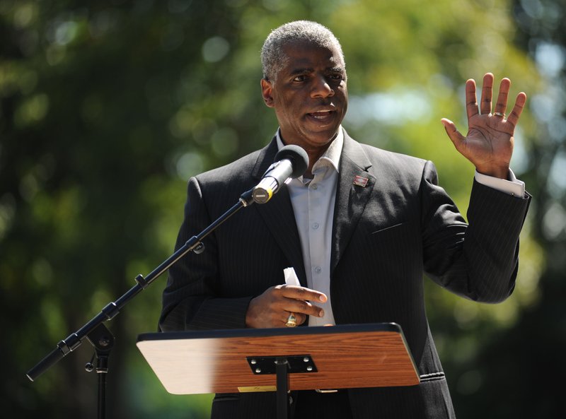 File Photo/NWA Democrat-Gazette/ANDY SHUPE Joseph Wood, then the Arkansas deputy secretary of state, speaks in September 2014 during a dedication ceremony for the Gehring Cemetery at Christian Life Cathedral in Fayetteville.