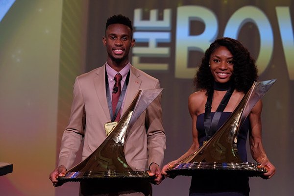 Jarrion Lawson, left, and Courtney Okolo pose with their Bowerman Awards during a banquet Friday, Dec. 16, 2016, in Orlando, Fla. 