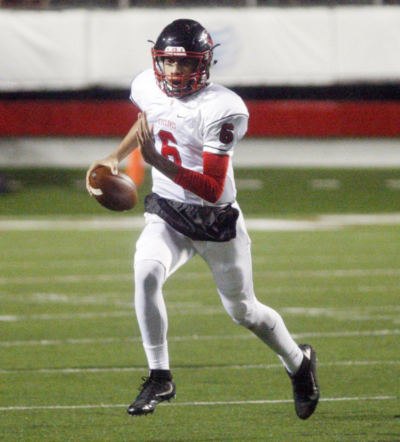 Russellville senior quarterback Cale Fulsom runs for a first down during the Class 6A state-championship game Dec. 3 at War Memorial Stadium in Little Rock. 