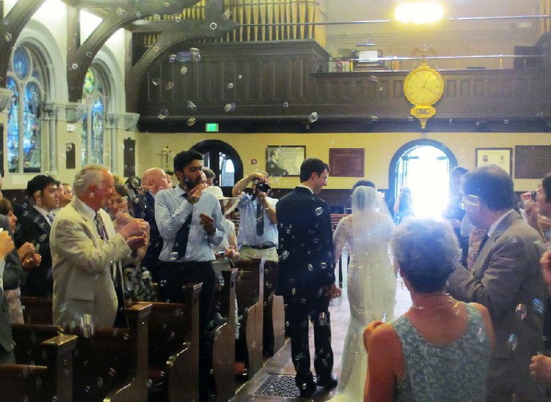 Guests blow bubbles into the air at the wedding of Matthew and Meredith Ritter in Brookline, Mass. in July. Blowing bubbles has become an alternative to throwing rice at weddings.