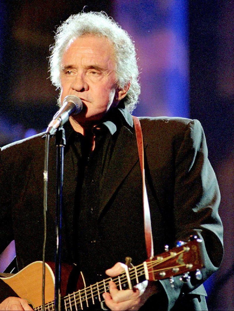 Poems written by American music legend Johnny Cash, shown in a 1995 concert, have been published in the book Forever Words: The Unknown Poems. 