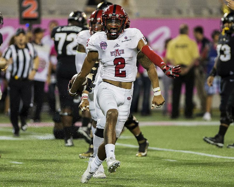 Arkansas State defender Nehemiah Wagner celebrates a defensive stop by the Red Wolves.