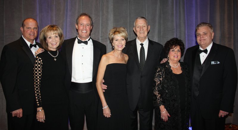 Mark and Sara Moses (from left), Tony and Mary Beth Sherman, Pete and Shirley Esch and Kent Whillock help support Mercy Health Foundation at the O Night Divine Charity Ball on Dec. 3 at the John Q. Hammons Center
in Rogers. The family was honored as the foundation’s Family of the Year at the fundraiser.