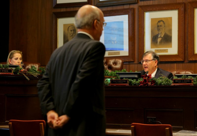 District Judge Vic Fleming paces last week as Little Rock City Attorney Tom Carpenter explains why the city’s district court judges are not owed for their accrued leave time.