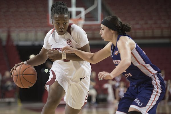 Arkansas' Aaliyah Wilson drives downcourt while Northwestern State's Beatrice Attura defends Sunday Dec. 18, 2016 at Bud Walton Arena in Fayetteville.