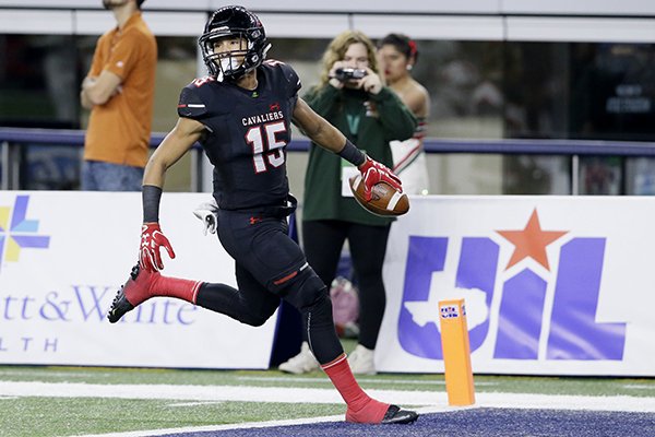 Lake Travis running back Maleek Barkley (15) runs into the end zone for a touchdown after catching a pass during the first half of the Class 6A Division I state football championship against the Woodlands in Arlington, Texas, Saturday, Dec. 17, 2016. (AP Photo/LM Otero)

