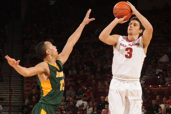 Dusty Hannahs (3) of Arkansas takes a shot over Khy Kabellis of North Dakota State Tuesday, Dec. 20, 2016, during the second half of play in Bud Walton Arena. Visit nwadg.com/photos to see more photographs from the game.