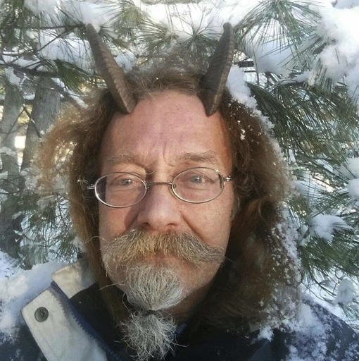 This Dec. 7, 2016, photo provided by Phelan Moonsong shows a portrait of himself in Portland, Maine. Moonsong, an ordained Pagan priest, finally has gotten the OK to sport goat horns in his Maine driver's license photo. 