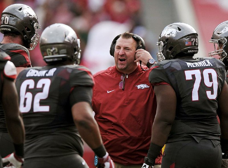 NWA Democrat-Gazette/BEN GOFF @NWABENGOFF
Bret Bielema, Arkansas coach, huddles with players after a touchdown against Florida in the 1st quarter on Saturday Nov. 5, 2016 during the game at Razorback Stadium in Fayetteville. 