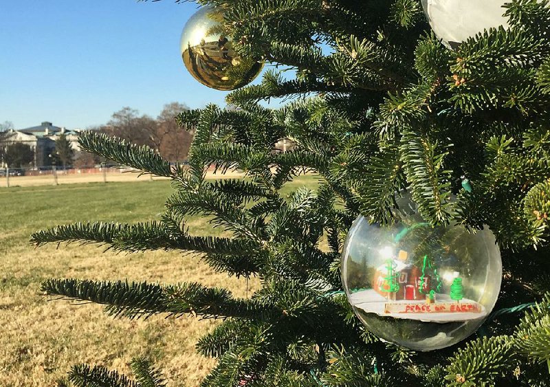 All of the states and U.S. territories have a Christmas tree to decorate in Washington, D.C. Arkansas’ tree has ornaments made by patients at Arkansas Children’s Hospital. The White House is seen in the background.