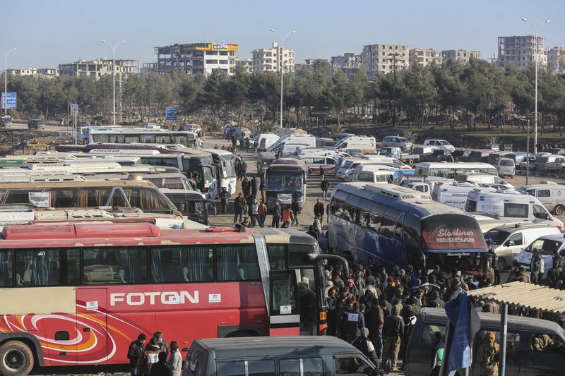 Syrians evacuated from the embattled Syrian city of Aleppo during the ceasefire arrive at a refugee camp in Rashidin, near Idlib, Syria, Tuesday, Dec. 20, 2016. 