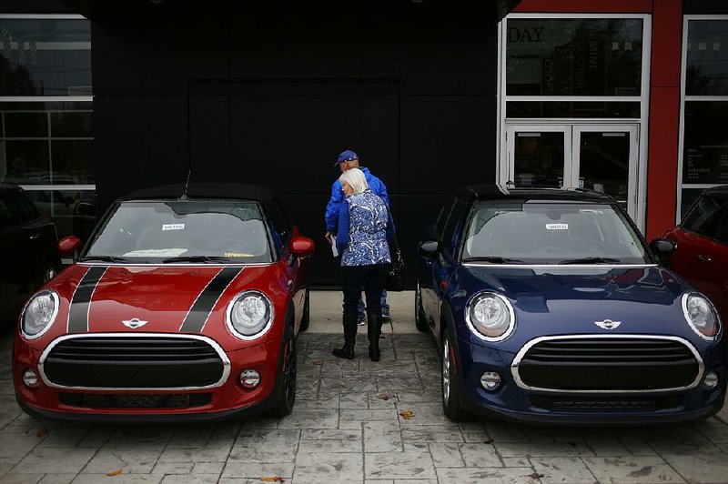 Shoppers look at Mini Cooper vehicles at a dealership in Louisville, Ky., in November. Auto experts predict sales will level off in 2017 after two strong years. 
