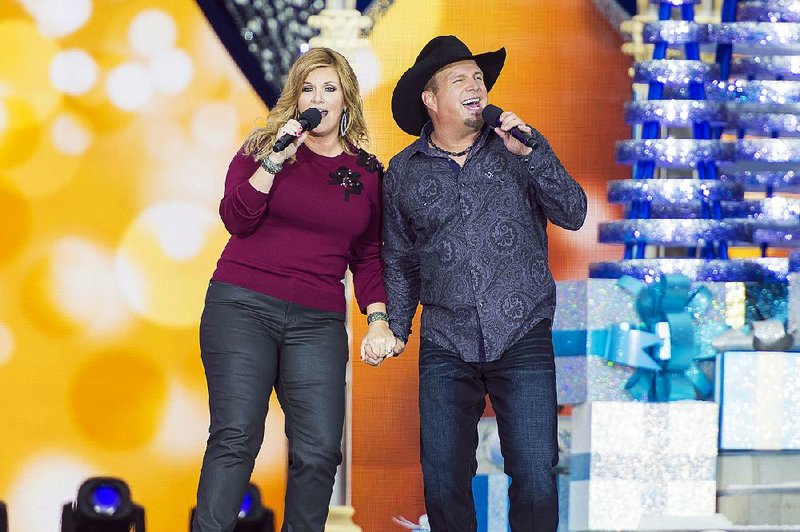 Trisha Yearwood and Garth Brooks will perform on ABC’s annual Disney Parks Magical Christmas Celebration at 9 a.m. today.
