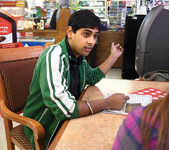The Sentinel-Record/Mara Kuhn CLOSE CALL: Sunny Singh, manager of Mountain Pine Corner Store, speaks with The Sentinel-Record Friday at the store, located at 2702 Mountain Pine Road, about the armed burglar he shot while protecting the store and himself Thursday morning.