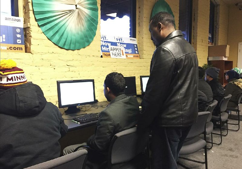 People use the computers Tuesday at an employment center in Minneapolis’ largest Somali neighborhood.