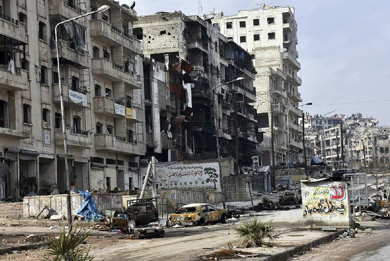 The damage caused by fighting in the Ansari neighborhood on the eastern side of Aleppo, Syria, is shown Friday in this photo released by Syria’s state-run news agency.