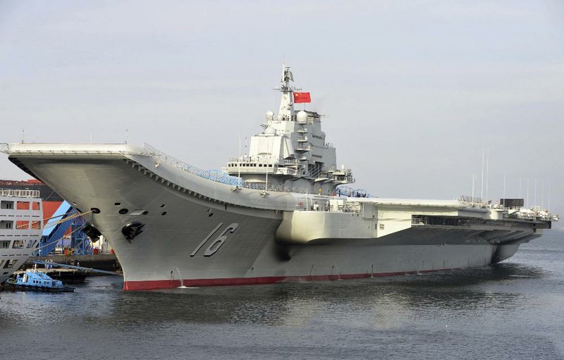 China’s aircraft carrier Liaoning berths in a port of China in this undated file photo released by China’s Xinhua News Agency.