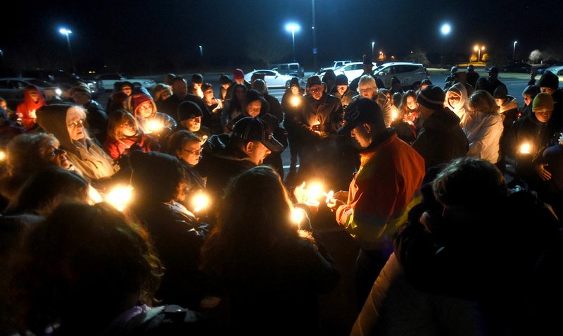 Friends and family of Carol Davidson gathered in Springdale in December during a candlelight vigil for Davidson and her daughter RoseMarry. In February, police identified a body found near Siloam Springs as Davidson's.