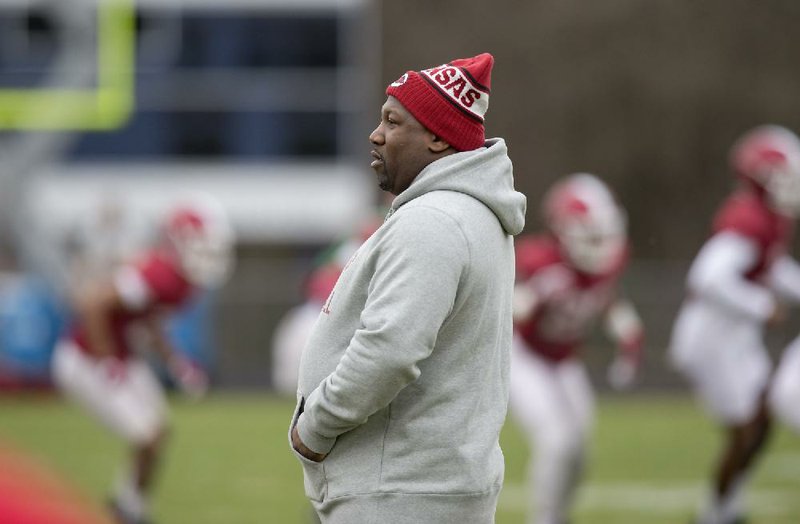 Arkansas director of recruiting E.K. Franks watches during Razorbacks practice on Monday, Dec. 26, 2016, at Charlotte Latin High School. 