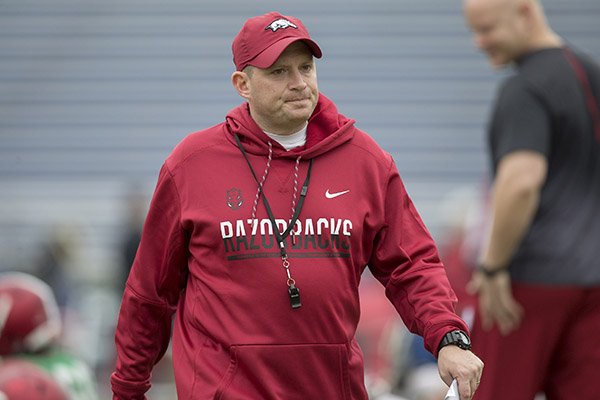 Arkansas defensive coordinator Robb Smith watches practice Monday, Dec. 26, 2016, at Charlotte Latin High School in Charlotte, N.C.