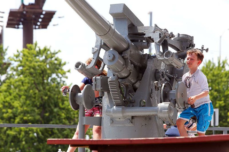 The Arkansas Inland Maritime Museum in North Little Rock offers children a chance to learn aboard a World War II submarine, the USS Razorback.
