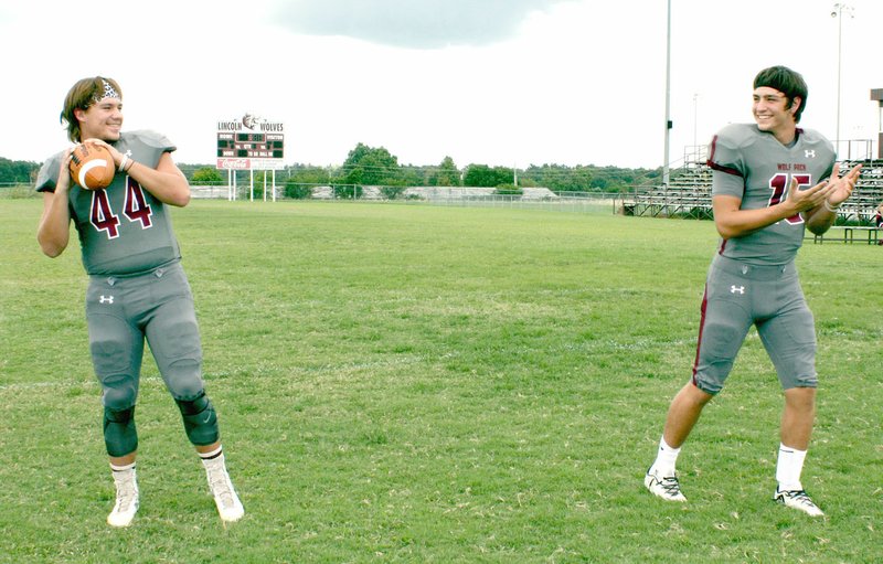 MARK HUMPHREY ENTERPRISE-LEADER Senior quarterback Harrison Swayne (right), shown going out for a pass from sophomore halfback Caleb Lloyd, a play Lincoln ran in their season finale against Prairie Grove, has been selected male Athlete of the Year for 2016 at Lincoln by the Enterprise-Leader.