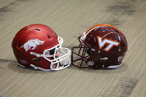 Arkansas and Virginia Tech football helmets are displayed during Belk Bowl Media Day on Wednesday, Dec. 28, 2016, at BB&T Ballpark in Charlotte, N.C. The Razorbacks and Hokies are scheduled to play Thursday at 4:30 p.m. at Bank of America Stadium in Charlotte. 