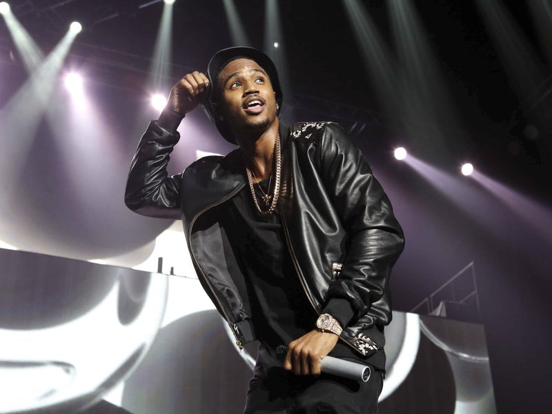 FILE - In this March 2, 2015, file photo, Trey Songz performs during the Between The Sheets Tour at Philips Arena in Atlanta. Police say Songz has been arrested for throwing microphones and speakers from the stage during a performance at Joe Louis Arena in Detroit. The Detroit Police Department says Songz, whose real name is Tremaine Neverson, was arrested Wednesday, Dec. 28, 2016, after the show. (Photo by Robb D. Cohen/Invision/AP, File)
