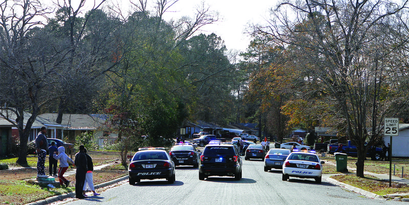 Police response: El Dorado Police Officers along with members of Union County Animal Control arrive in full force at a residence on Lakeland Street after a pit bull bit a man on Thursday.