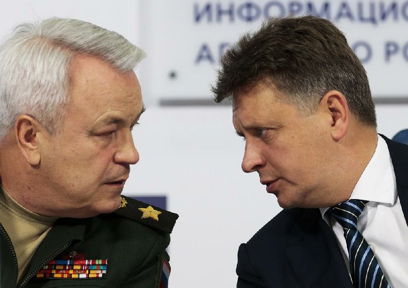 Russian Transport Minister Maxim Sokolov (right) speaks with Deputy Defense Minister Nikolay Pankov at a briefing Thursday in Moscow regarding Sunday’s plane crash. Sokolov said a technical malfunction caused the crash.