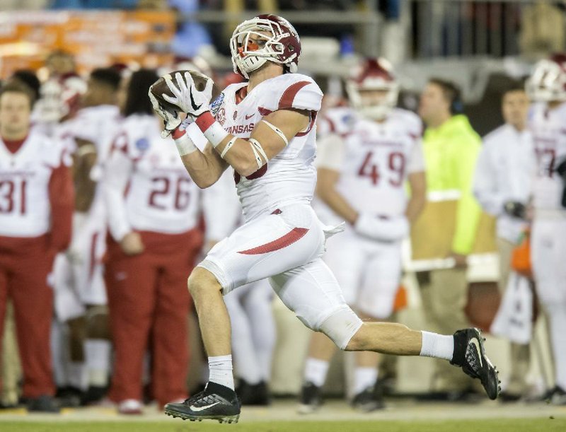 NWA Democrat-Gazette/JASON IVESTER
Arkansas Razorbacks wide receiver Drew Morgan (80) hauls in a long pass in the third quarter against Virginia Tech during the Belk Bowl on Thursday, Dec. 29, 2016, at Bank of America Stadium in Charlotte, N.C.