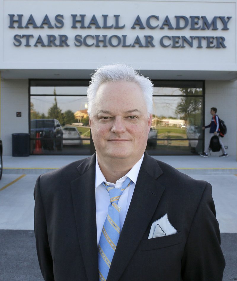 Martin Shoppmeyer, superintendent of Haas Hall Academy, poses in front of the school’s Fayetteville campus. Schoppmeyer launched Northwest Arkansas School Choice to educate the community about the region’s various educational options.