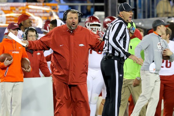 Arkansas coach Bret Bielema argues the "inadvertent whistle" call late in the 2nd quarter of The Belk Bowl Thursday in Charlotte, North Carolina.
