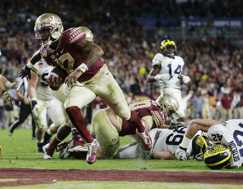 Florida State quarterback Deondre Francois (12) threw for two touchdowns and ran for a third to lead the No. 11 Seminoles to a 33-32 victory over No. 6 Michigan on Friday at the Orange Bowl in Miami Gardens, Fla.