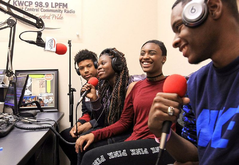Little Rock Central High School students Norel McAdoo (from left), Tanya Sisa, Paige Mitchell and Chauncey Williams-Weasley host the Writeous Hour poetry slam program on the West Central Community Radio station 98.9 FM earlier this month.