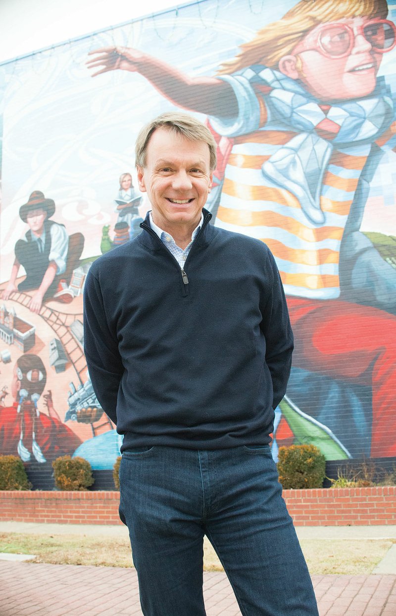 Tab Townsell, who was Conway mayor for 18 years, stands in front of the City Hall mural. Townsell said downtown revitalization is one of the accomplishments of which he is most proud. He has been hired as executive director of Metroplan in Little Rock, the central-Arkansas planning agency.