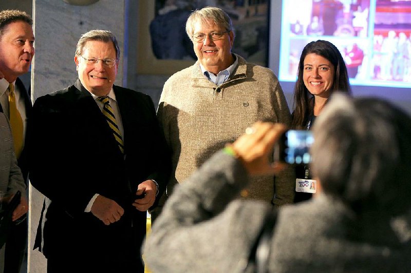 Little Rock Mayor Mark Stodola and Little Rock Zoo Director Susan Altrui flank Brad Cazort at a ceremony last month recognizing Cazort for his years of service as a city director.