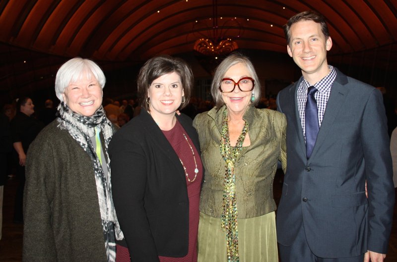 NWA Democrat-Gazette/CARIN SCHOPPMEYER Alice Walton, Crystal Bridges Museum of American Art founder and board chairwoman (second from right), with Rod Bigelow, museum executive director (from right), Jill Wagar, chief strategy officer, and Sandy Edwards, deputy director, welcome original members for a reception Dec. 12 at the musuem.