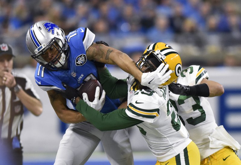 Detroit Lions wide receiver Marvin Jones is pushed out of bounds by Green Bay Packers cornerback Damarious Randall (23) during the first half of an NFL football game, Sunday, Jan. 1, 2017, in Detroit. 